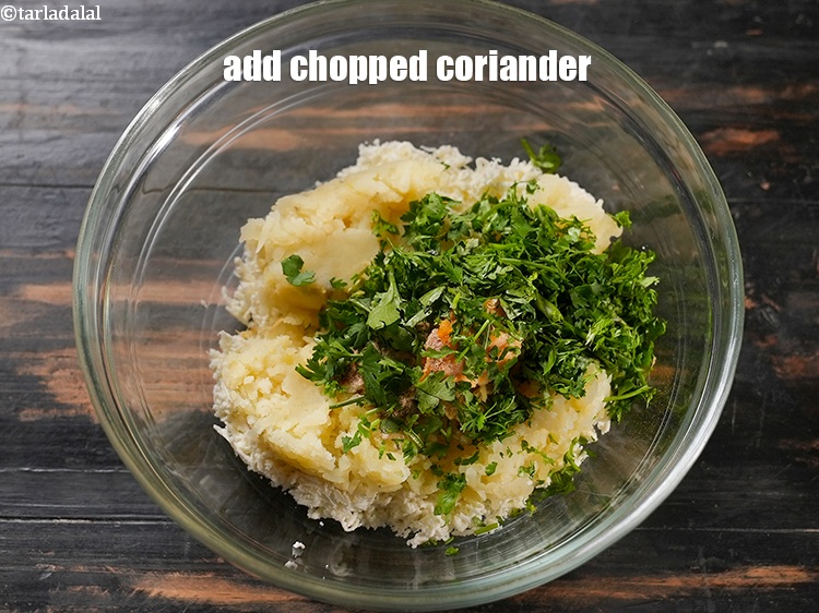 Step 13 – Add 2 tbsp <a href="https://www.tarladalal.com/glossary-chopped-coriander-783i">chopped coriander (dhania)</a>.&nbsp;