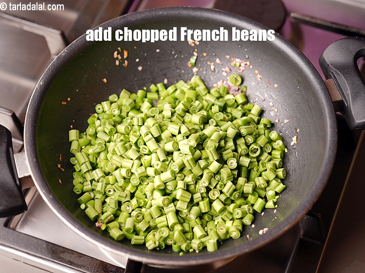 Step 12 – Add 2 1/2 cup&nbsp;<a href="https://www.tarladalal.com/glossary-chopped-french-beans-797i">chopped french beans</a>.