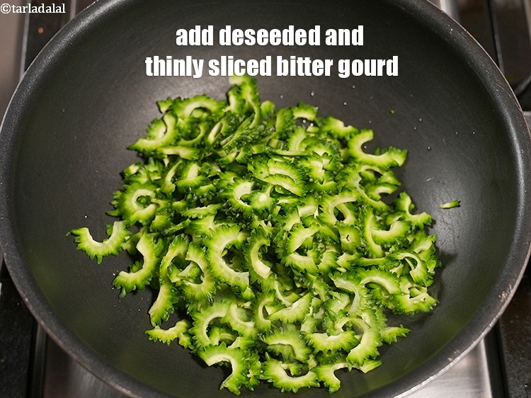 Step 12 – Add 2 cups deseeded and thinly&nbsp;<a href="https://www.tarladalal.com/glossary-sliced-bitter-gourd-1145i">sliced bitter gourd (karela)</a>.