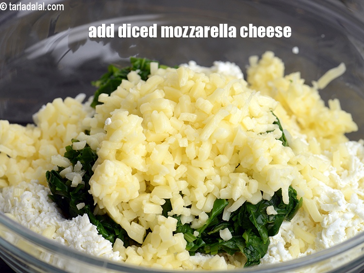 Step 14 – Add &frac12; cup <a href="https://www.tarladalal.com/glossary-diced-mozzarella-cheese-2805i">diced mozzarella cheese</a>.