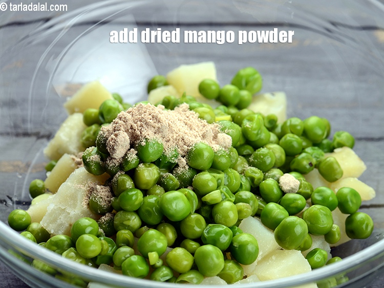 Step 12 – Add 1 tsp&nbsp;<a href="https://tarladalal.com/glossary-dried-mango-powder-amchur-powder-148i">dried mango powder (amchur)</a>.