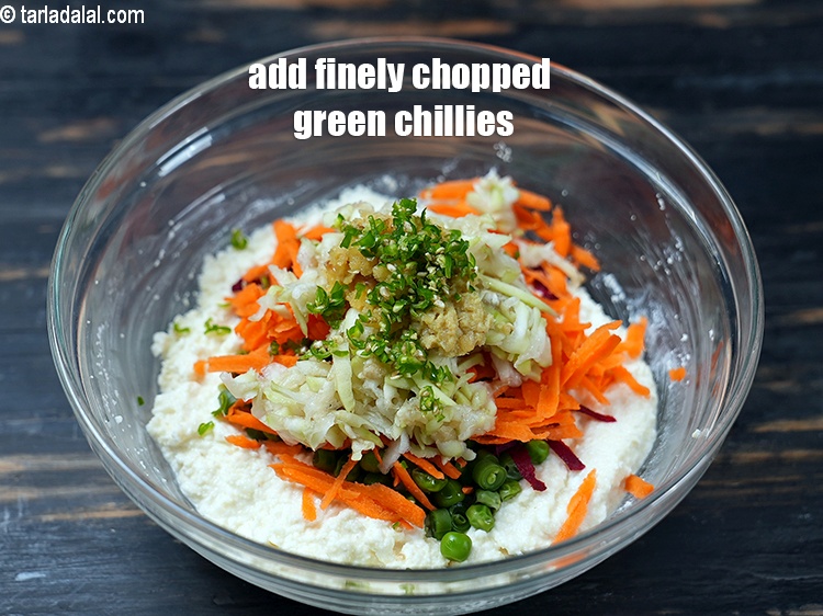 Step 13 – Add 1 tsp finely <a href="https://www.tarladalal.com/glossary-chopped-green-chilli-820i">chopped green chillies</a>.