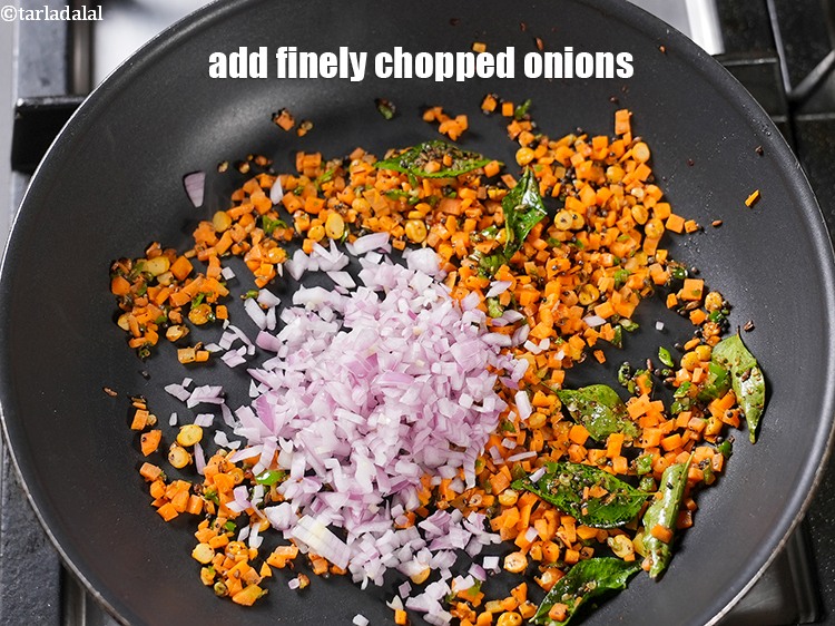 Step 12 – Add &frac14; cup finely <a href="https://www.tarladalal.com/glossary-chopped-onions-722i">chopped onions</a>.