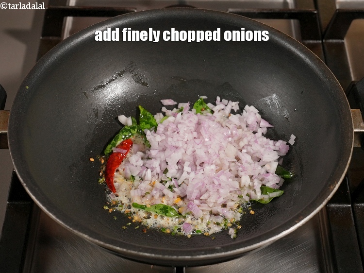 Step 12 – Add &frac14; cup finely&nbsp;<a href="https://www.tarladalal.com/glossary-chopped-onions-722i">chopped onions</a>.