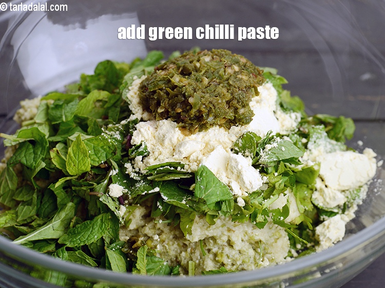 Step 12 – Add 2 tsp <a href="https://www.tarladalal.com/glossary-green-chilli-paste-hari-mirch-ki-paste-mirchi-paste-333i">green chilli paste</a>.