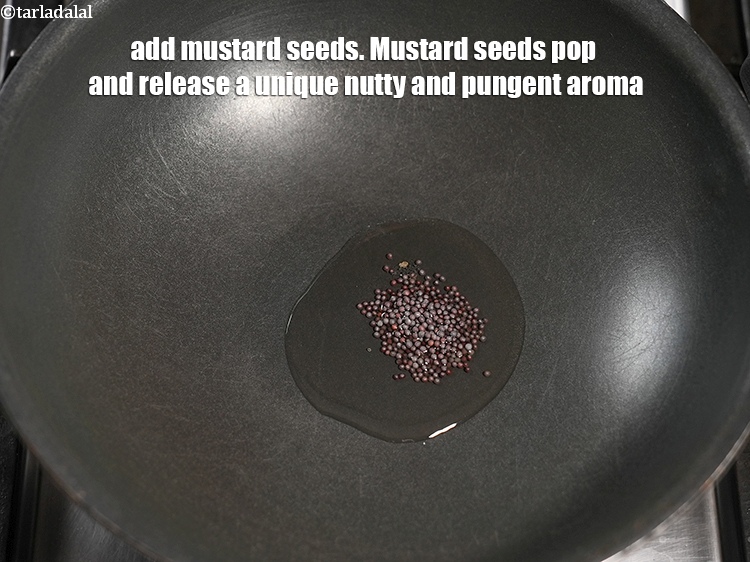 Step 12 – Add &frac12; tsp <a href="https://www.tarladalal.com/glossary-mustard-seeds-sarson-rai-sarson-ke-beej-525i">mustard seeds ( rai / sarson)</a>. Mustard seeds pop and release …