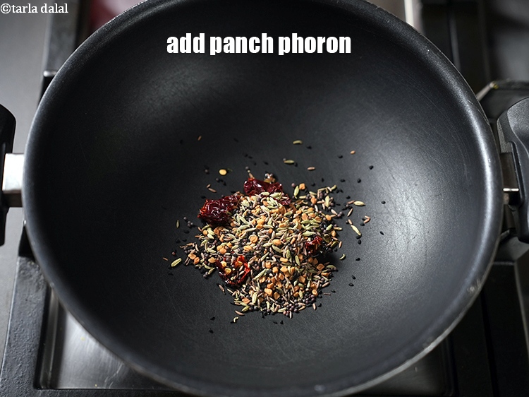 Step 17 – Add 2 tbsp of <a href="https://www.tarladalal.com/glossary-panch-phoron-1027i">panch phoron</a>.&nbsp;