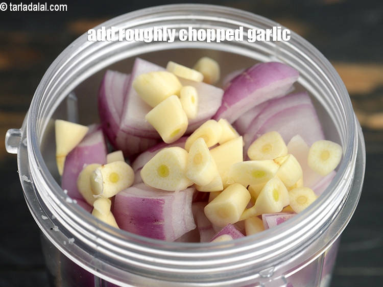 Step 14 – Add 1 tbsp roughly <a href="https://www.tarladalal.com/glossary-chopped-garlic-790i">chopped garlic (lehsun)</a>.