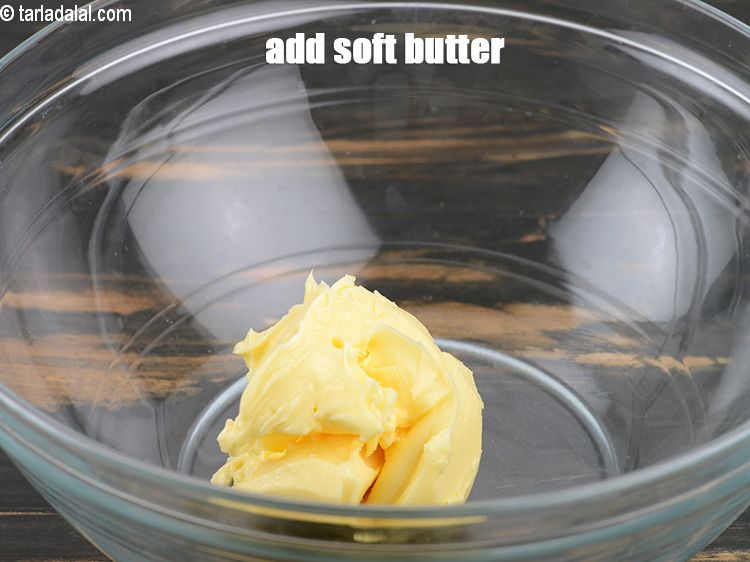 Step 13 – Add &frac12; cup <a href="https://www.tarladalal.com/glossary-soft-butter-naram-makhan-1942i">soft butter</a>.