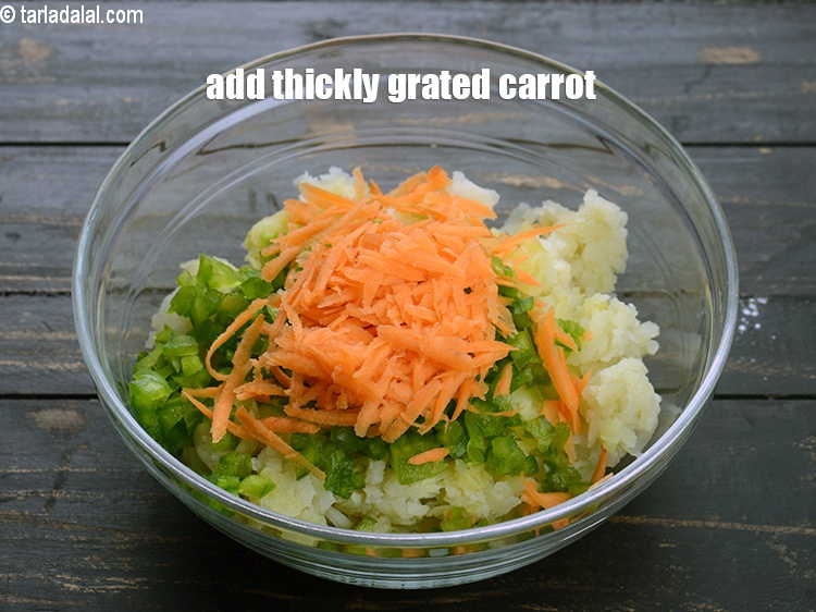 Step 13 – Add &frac14; cup thickly <a href="https://www.tarladalal.com/glossary-grated-carrot-816i">grated carrot</a>.