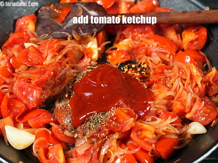 Step 12 – Add 2 tbsp <a href="https://www.tarladalal.com/glossary-tomato-ketchup-tomato-sauce-181i">tomato ketchup</a>.
