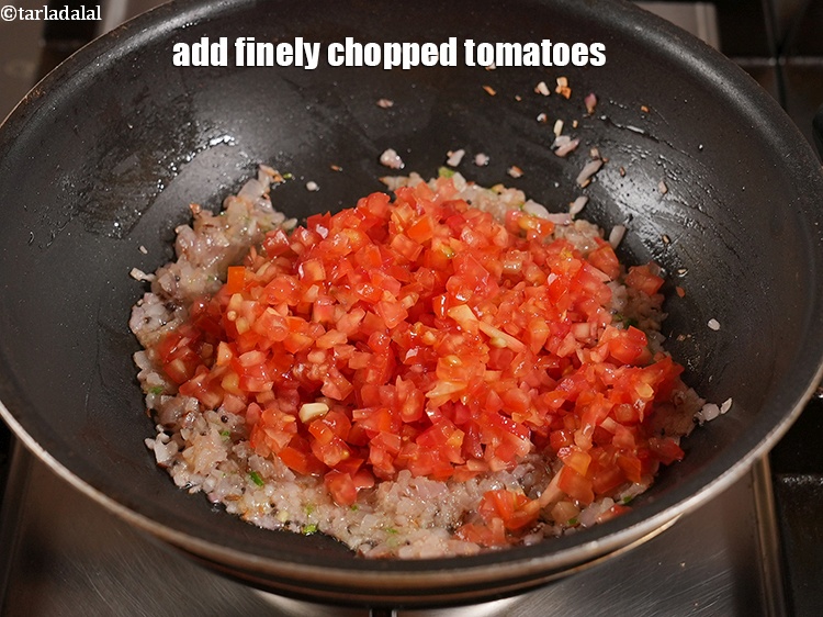 Step 12 – Add 1 cup&nbsp;finely&nbsp;<a href="https://www.tarladalal.com/glossary-chopped-tomatoes-779i">chopped tomatoes</a>.