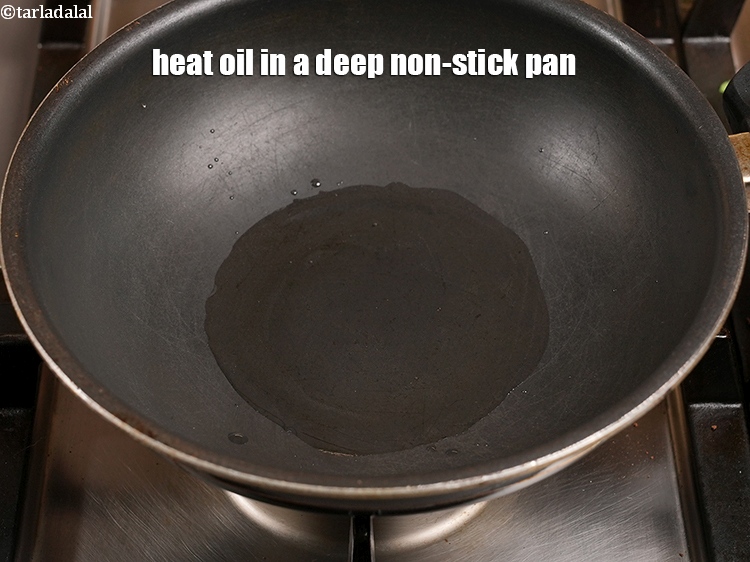 Step 12 – Heat 3 tbsp <a href="https://www.tarladalal.com/glossary-oil-671i">oil</a> in a deep non-stick pan.