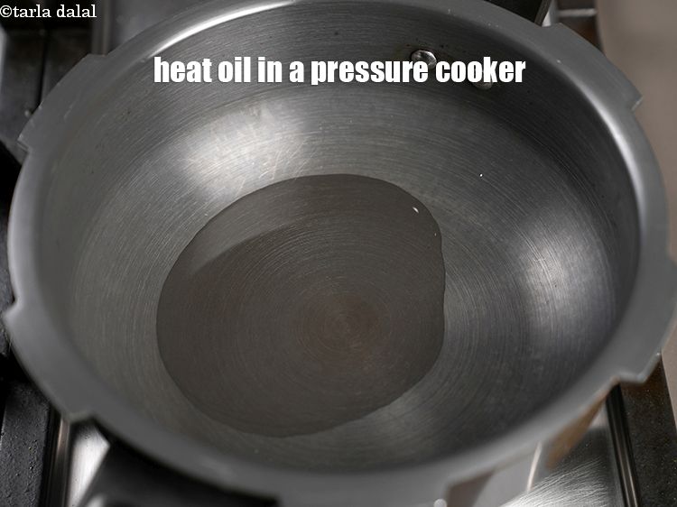 Step 12 – Heat 2 tbsp oil in a pressure cooker.