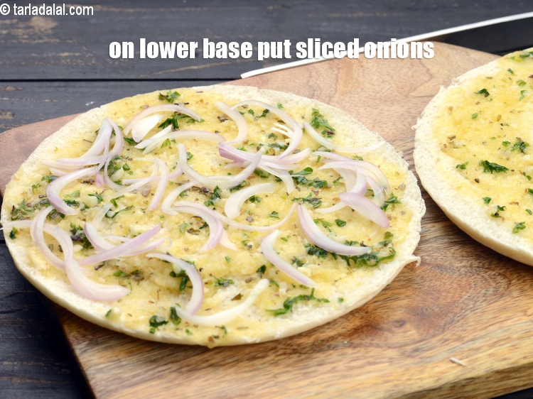 Step 12 – One the lower base halve put a little sliced onions.