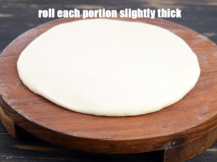 Step 12 – Roll each portion slightly thick into 175 mm. (7&rdquo;) diameter circle using little plain flour …