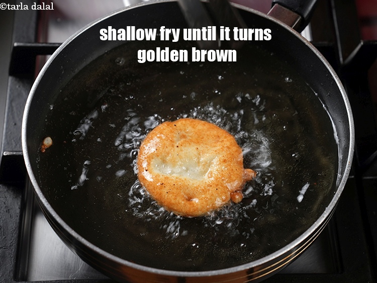 Step 24 – Shallow fry the malpuas on medium flame until it turns golden brown in colour from …