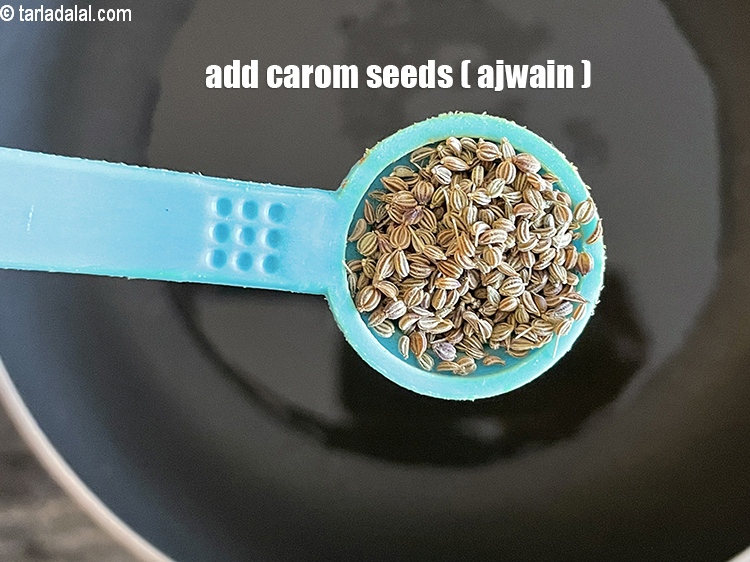 Step 23 – Add&nbsp;<meta charset="UTF-8" />1/2 tsp&nbsp;<a href="glossary-carom-seeds-ajwain-thymol-seeds-bishops-weed-266i">carom seeds (ajwain)</a>.