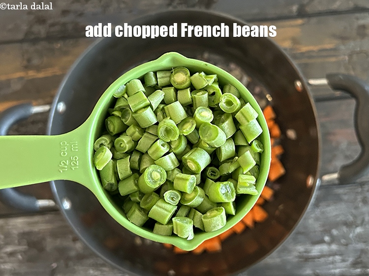 Step 12 – Add&nbsp;<meta charset="UTF-8" />1/2 cup&nbsp;<a href="glossary-chopped-french-beans-797i">chopped french beans</a>.