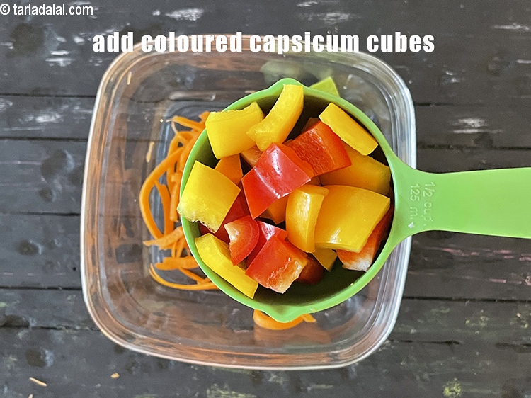 Step 14 – Add&nbsp;<meta charset="UTF-8" />1/2 cup&nbsp;capsicum (&nbsp;<a href="glossary-diagonally-cut-red-capsicum-2337i">red</a>&nbsp;and&nbsp;<a href="glossary-chopped-yellow-capsicum-2300i">yellow</a>) cubes.