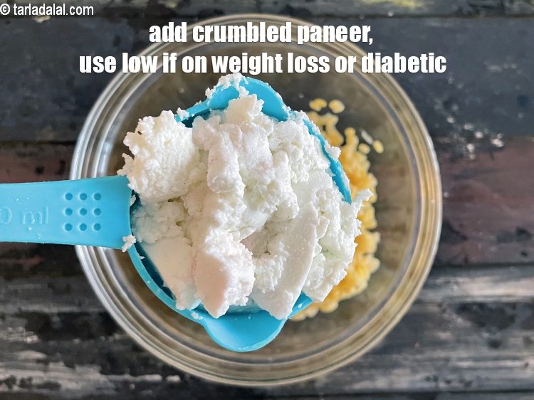 Step 20 – Add&nbsp;<meta charset="UTF-8" />1/2 cup&nbsp;<a href="glossary-crumbled-low-fat-paneer-1117i">low-fat crumbled paneer</a>.
