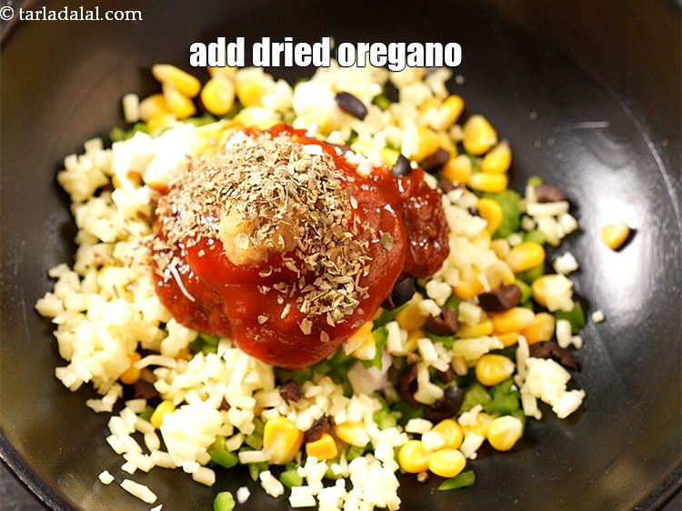 Step 12 – Add 1 tsp <a href="https://www.tarladalal.com/glossary-dried-oregano-268i">dried oregano</a>.