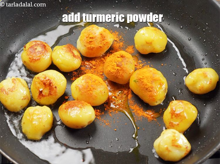 Step 12 – Add &frac14; tsp&nbsp;<a href="https://www.tarladalal.com/glossary-turmeric-powder-haldi-645i">turmeric powder (haldi)</a>.