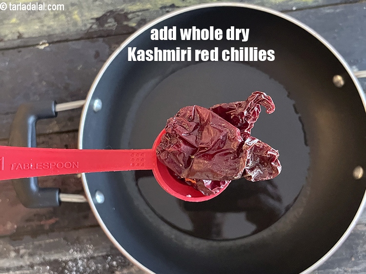 Step 18 – Add&nbsp;<meta charset="UTF-8" />2&nbsp;<a href="glossary-whole-dry-kashmiri-red-chillies-kashmiri-mirch-kashmiri-lal-mirch-332i">whole dry kashmiri red chillies</a>&nbsp;, broken into pieces.