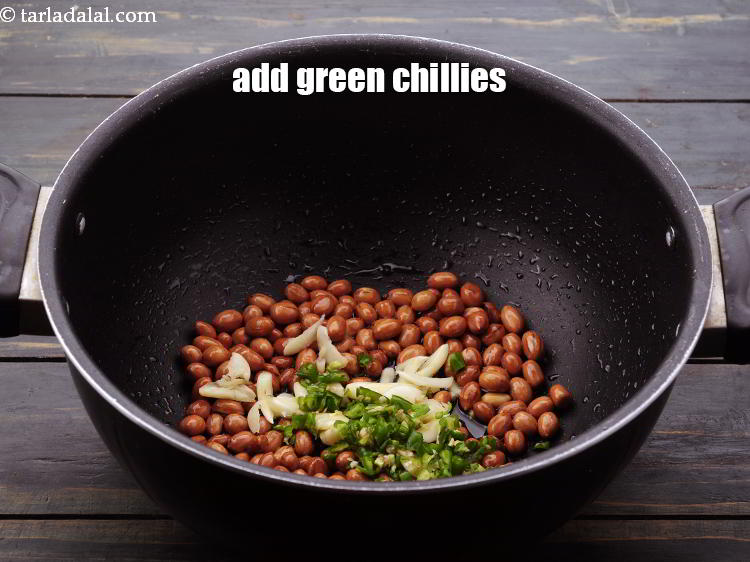 Step 11 – Add <a href="https://www.tarladalal.com/glossary-green-chillies-hari-mirch-331i#ing_820" target="_blank">green chillies</a>. Use the dark green variety of green chillies which is …