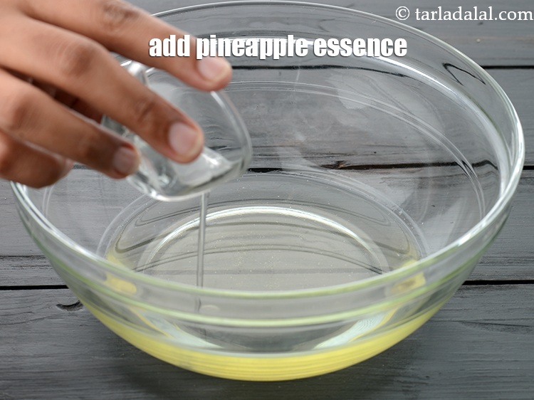 Step 12 – Add 1 tsp <a href="https://www.tarladalal.com/glossary-pineapple-essence-99i">pineapple essence</a>.&nbsp;