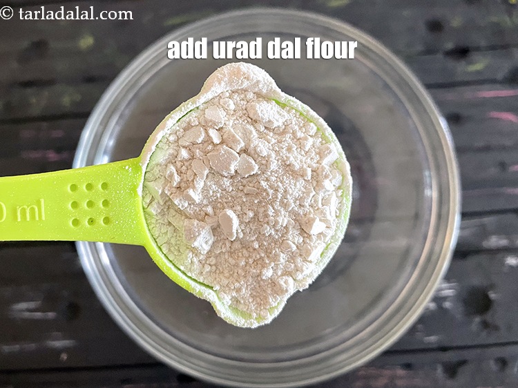 Step 12 – Add&nbsp;<meta charset="UTF-8" />1/4 cup&nbsp;<a href="glossary-urad-dal-flour-split-black-lentil-flour-urad-dal-ka-atta-1036i">urad dal (split black lentil) flour</a>.