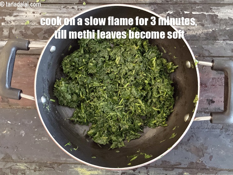 Step 12 – Cook on a <strong>slow flame</strong>&nbsp;for about 3 minutes till the fenugreek leaves become soft.