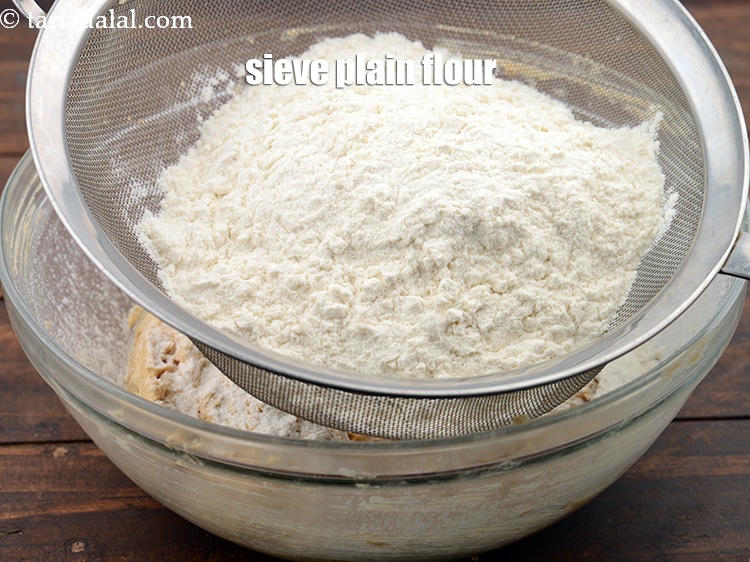 Step 12 – Sieve 2 cups&nbsp;<a href="https://www.tarladalal.com/glossary-plain-flour-maida-188i">plain flour (maida)</a>.