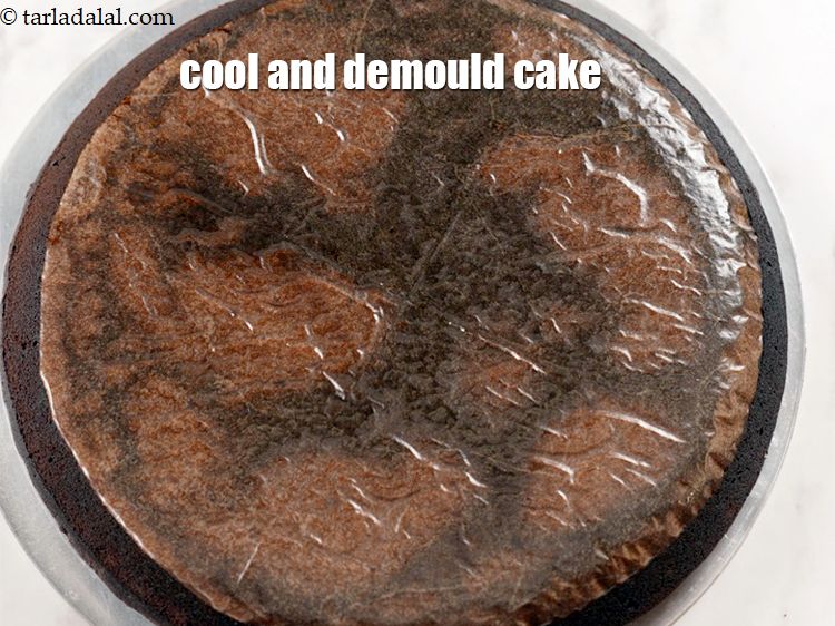 Step 12 – Remove and cool the cake slightly.&nbsp;Demould the cake.