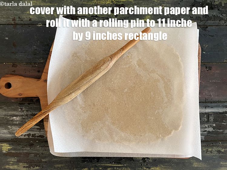Step 12 – Cover with another sheet of parchment paper&nbsp;and roll it slightly thick using a rolling pin&nbsp;to …
