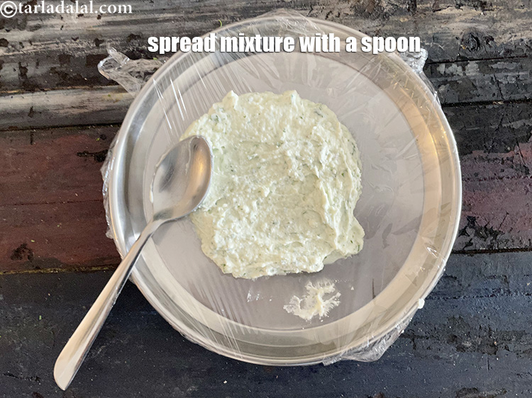 Step 13 – Spread out mixture into 3.5 inches diameter round over the thali with a spoon. You …