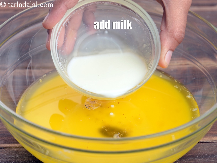 Step 12 – Add 1/4 cup <a href="https://www.tarladalal.com/glossary-milk-doodh-full-cream-milk-514i">milk</a>.