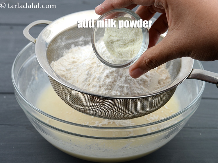 Step 12 – Add 1 tbsp <a href="https://www.tarladalal.com/glossary-milk-powder-517i">milk powder</a>.