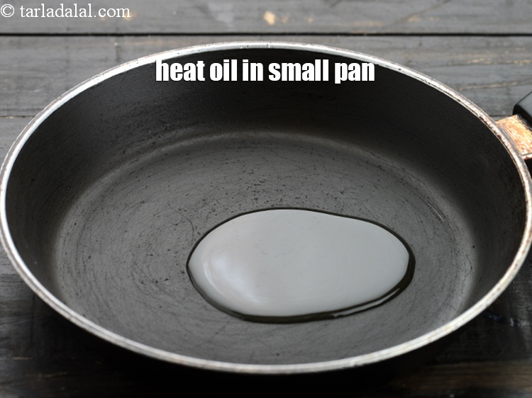Step 13 – Heat 1 tbsp&nbsp;<a href="https://www.tarladalal.com/glossary-oil-671i">oil</a>&nbsp;in a small pan.