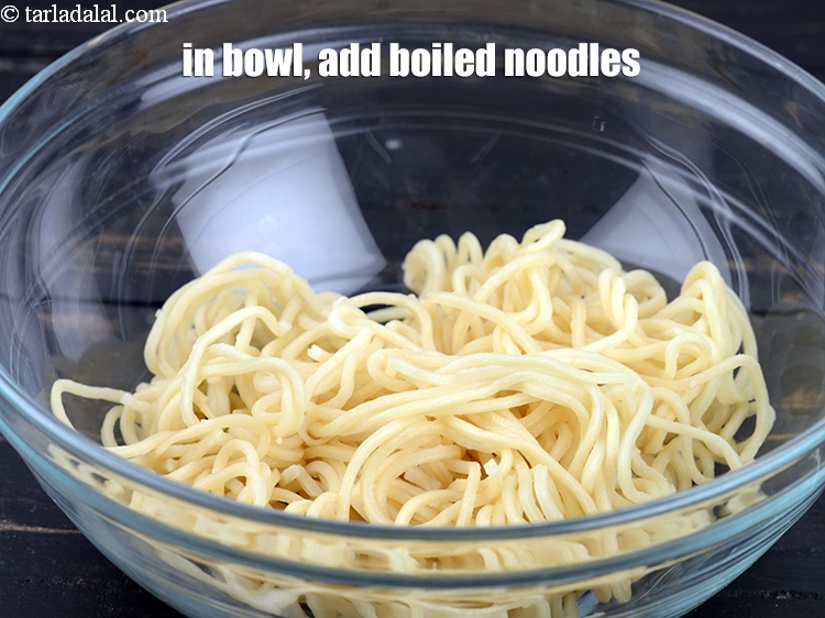 Step 13 – In a deep bowl, Add 1 cup <a href="https://www.tarladalal.com/glossary-boiled-noodles-2010i">boiled noodles</a>.