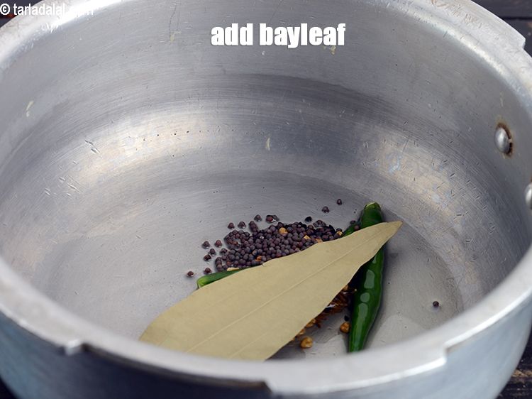 Step 12 – Add 1 <a href="https://www.tarladalal.com/glossary-bay-leaf-tejpatta-bay-leaves-189i">bayleaf (tejpatta)</a>.&nbsp;