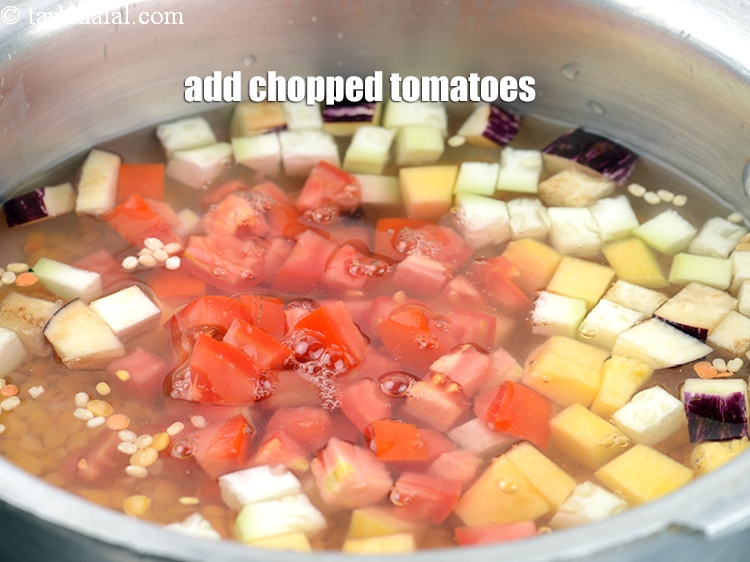 Step 13 – Add &frac12; cup <a href="https://www.tarladalal.com/glossary-chopped-tomatoes-779i">chopped tomatoes</a>.