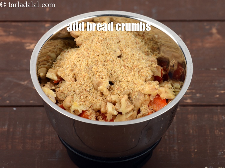 Step 12 – Add 2 tbsp <a href="https://www.tarladalal.com/glossary-bread-crumbs-breadcrumbs-222i">bread crumbs</a>.