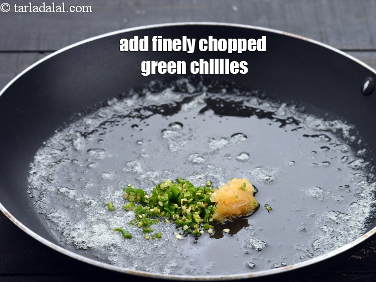 Step 12 – Add 1 1 tsp&nbsp;finely&nbsp;<a href="https://www.tarladalal.com/glossary-chopped-green-chilli-820i">chopped green chillies</a>.