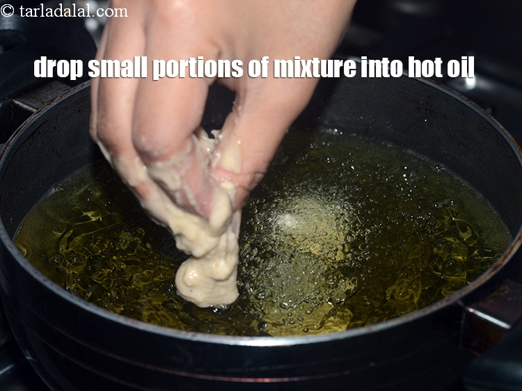 Step 12 – Drop small portions of the mixture using hands into the hot oil.