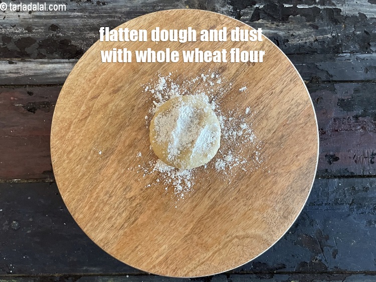 Step 13 – <meta charset="UTF-8" />Flatten the dough and dust with whole wheat flour.&nbsp;<br /> &nbsp;