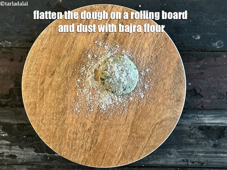 Step 13 – <meta charset="UTF-8" /> Flatten the dough ball on a rolling board and dust with bajra …
