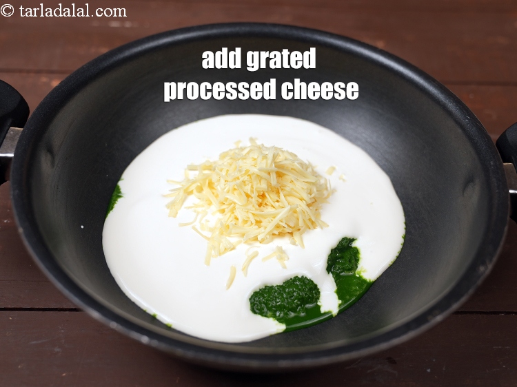 Step 13 – Add 1/2 cup&nbsp;<a href="https://www.tarladalal.com/glossary-grated-processed-cheese-868i">grated processed cheese</a>.