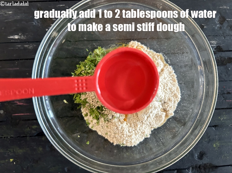 Step 21 – Gradually add&nbsp;1 to 2 tbsp of water to make a&nbsp;semi-stiff dough.
