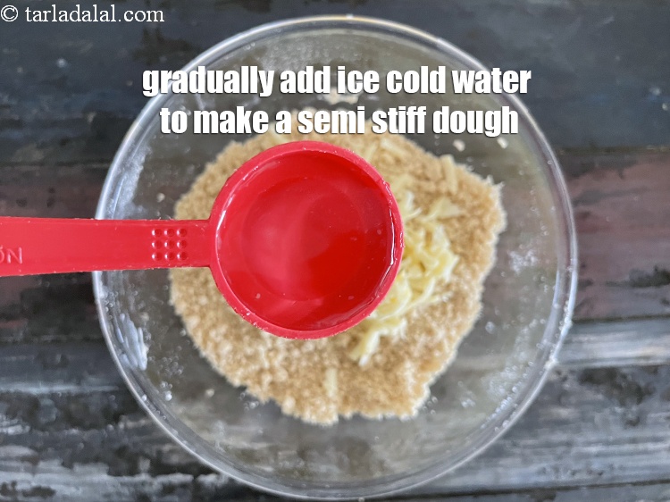 Step 12 – Gradually add&nbsp;2 1/2&nbsp;tbsp of ice-cold water&nbsp;while kneading the dough.